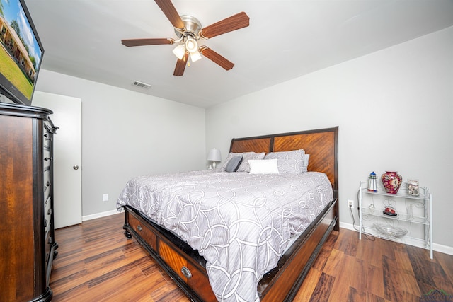 bedroom with dark wood-type flooring and ceiling fan