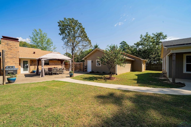 view of yard featuring a gazebo and a patio area