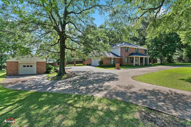 106 Brachfield Rd, Henderson, TX 75654 - view of front of property featuring brick siding, a front yard, and a detached garage