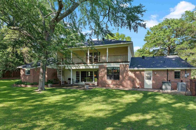 106 Brachfield Rd, Henderson, TX 75654 - back of house with a patio, central AC unit, brick siding, and stairs