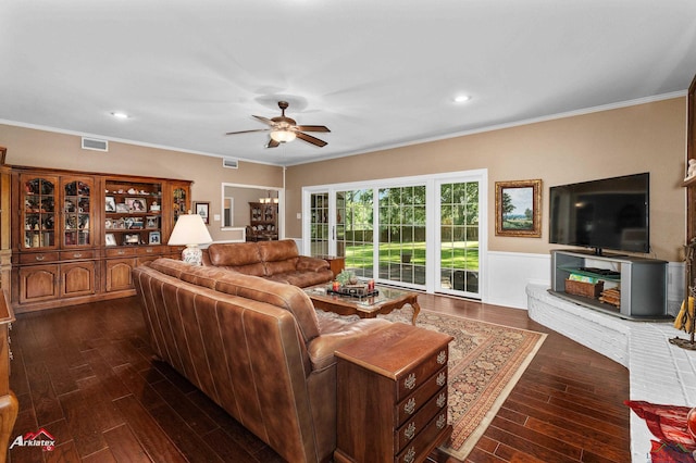 106 Brachfield Rd, Henderson, TX 75654 - living room featuring dark wood-style flooring, a ceiling fan, wainscoting, crown molding, and recessed lighting