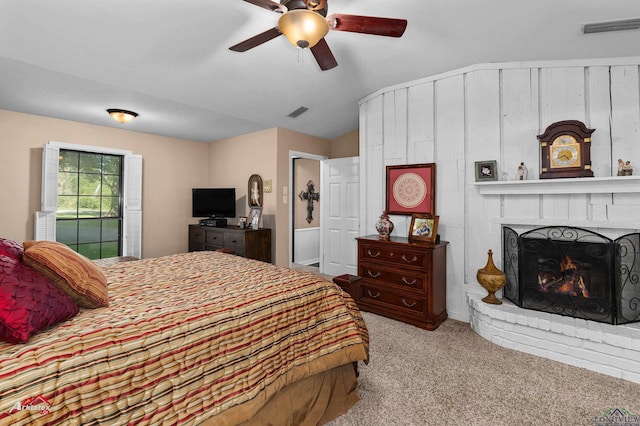 106 Brachfield Rd, Henderson, TX 75654 - carpeted bedroom featuring lofted ceiling, a fireplace, and ceiling fan