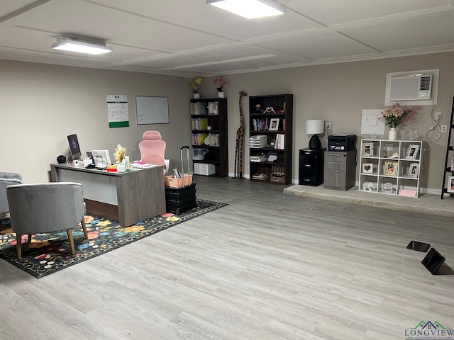 office space with light wood-type flooring and an AC wall unit