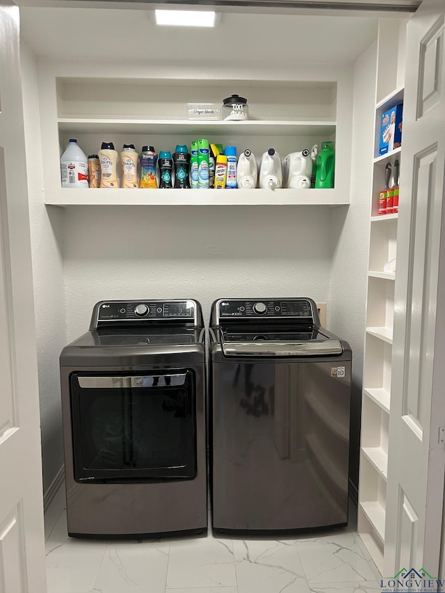 washroom with washer and clothes dryer