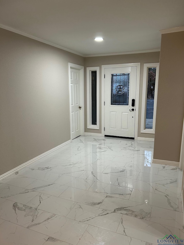 foyer entrance featuring crown molding