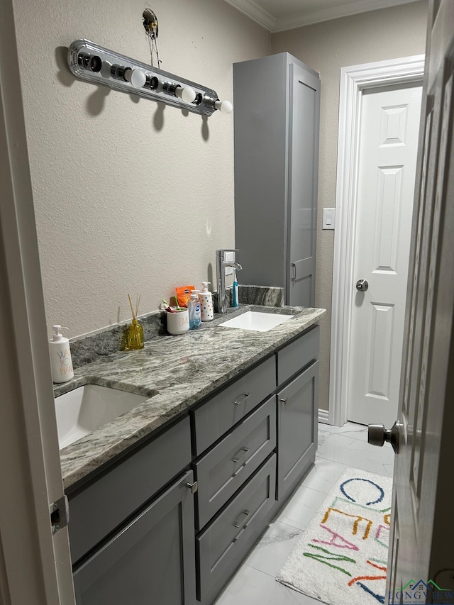 bathroom with vanity and crown molding