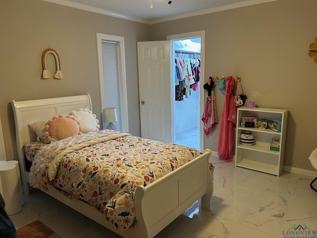 bedroom with a spacious closet, crown molding, and a closet