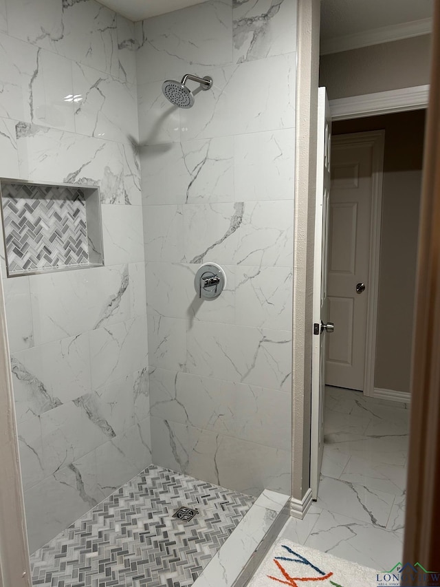 bathroom with a tile shower