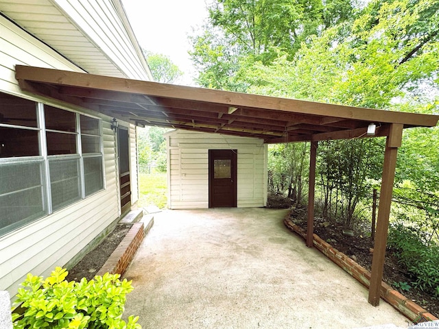 713 Martha Dr, Gladewater, TX 75647 - view of patio featuring a carport