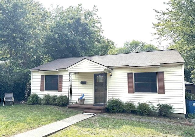 713 Martha Dr, Gladewater, TX 75647 - view of front of property with a front lawn