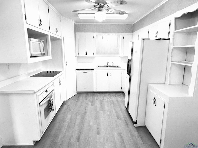 713 Martha Dr, Gladewater, TX 75647 - kitchen with white appliances, ornamental molding, a sink, wood finished floors, and ceiling fan