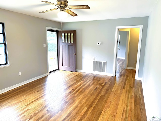 713 Martha Dr, Gladewater, TX 75647 - unfurnished room featuring light wood-type flooring, baseboards, and ceiling fan
