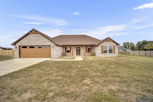 view of front facade featuring a front yard and a garage