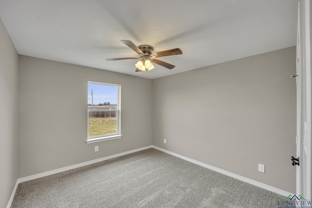 spare room featuring carpet flooring and ceiling fan