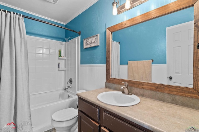 full bathroom with vanity, toilet, shower / bath combination with curtain, a wainscoted wall, and ornamental molding