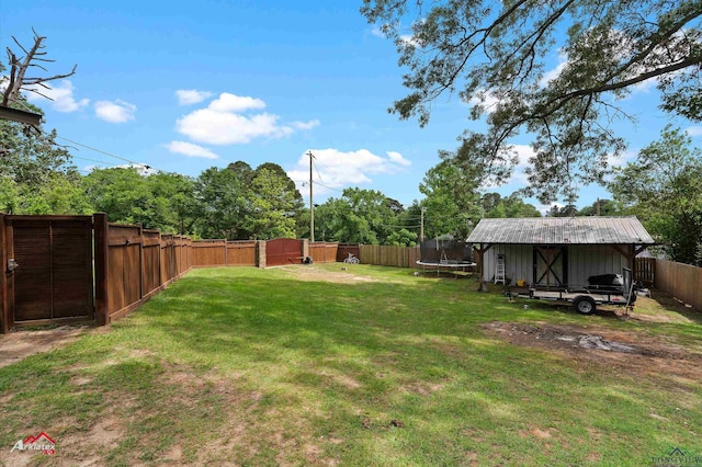 view of yard with an outdoor structure, a fenced backyard, a trampoline, and a storage shed