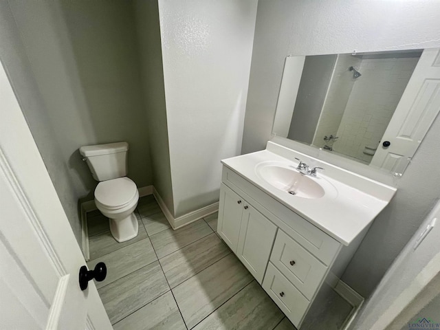 bathroom with tile patterned floors, vanity, and toilet