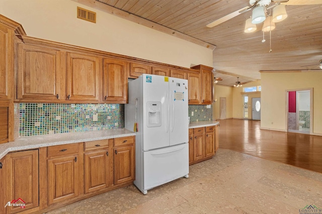 kitchen featuring tasteful backsplash, white fridge with ice dispenser, and wood ceiling