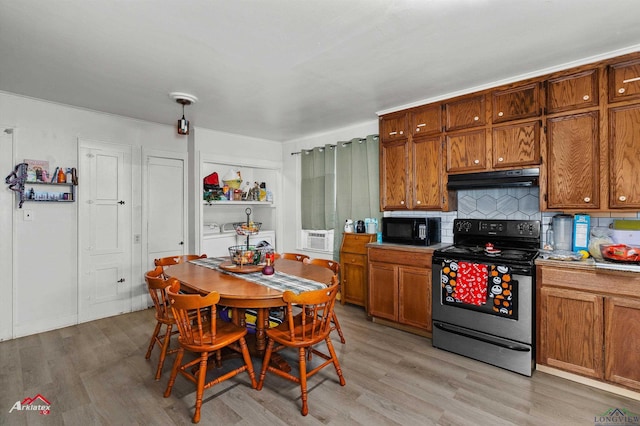 kitchen featuring range with electric cooktop, light hardwood / wood-style flooring, and backsplash