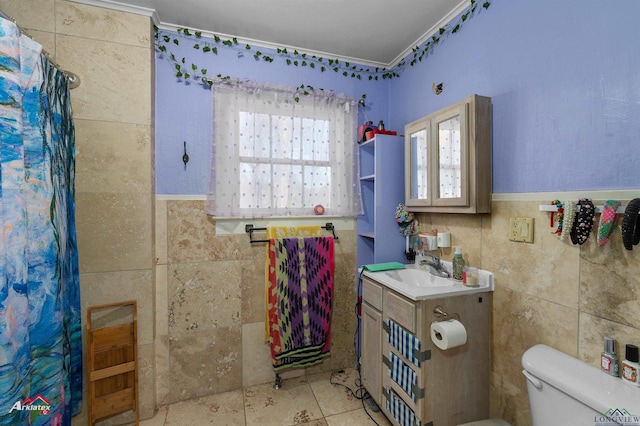 bathroom featuring ornamental molding, toilet, vanity, tile walls, and a shower with shower curtain