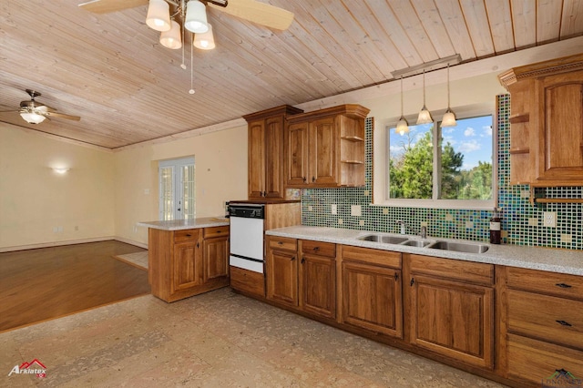 kitchen with decorative backsplash, white dishwasher, sink, pendant lighting, and wooden ceiling