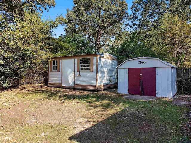 view of outbuilding featuring a lawn