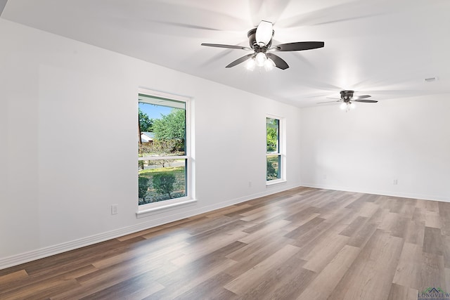 empty room featuring light hardwood / wood-style floors and ceiling fan