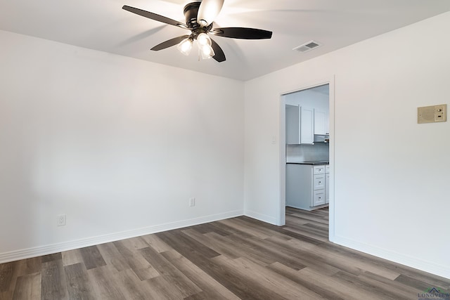 unfurnished room featuring ceiling fan and wood-type flooring