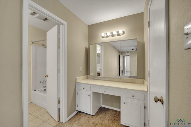 bathroom featuring tile patterned floors, shower / bathing tub combination, and vanity