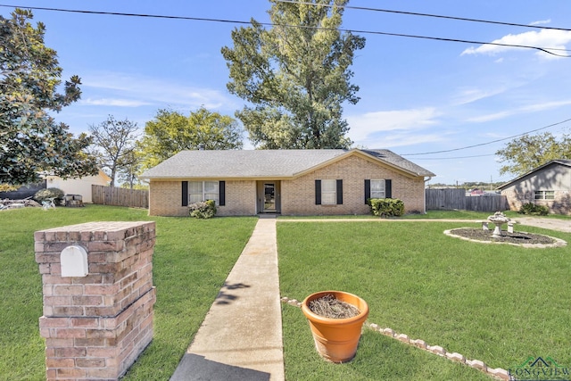 ranch-style home with a front lawn