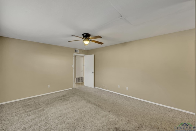 empty room featuring ceiling fan and carpet floors