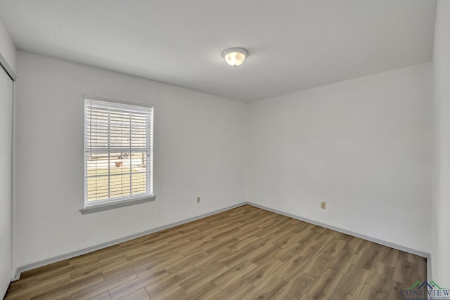 empty room featuring wood-type flooring