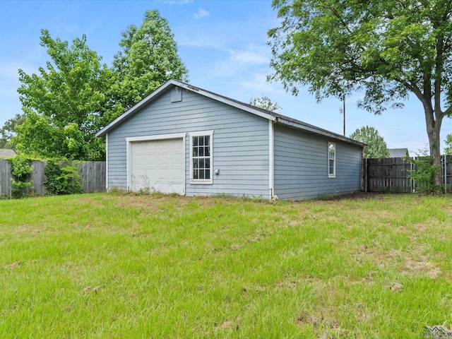 garage with a lawn