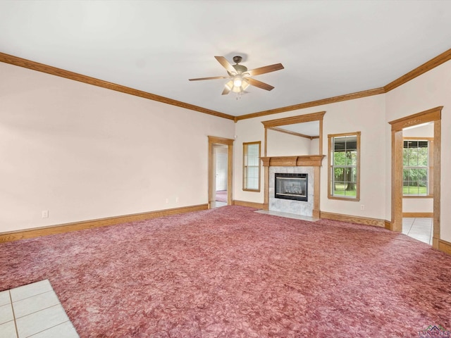 unfurnished living room with carpet floors, ceiling fan, and crown molding