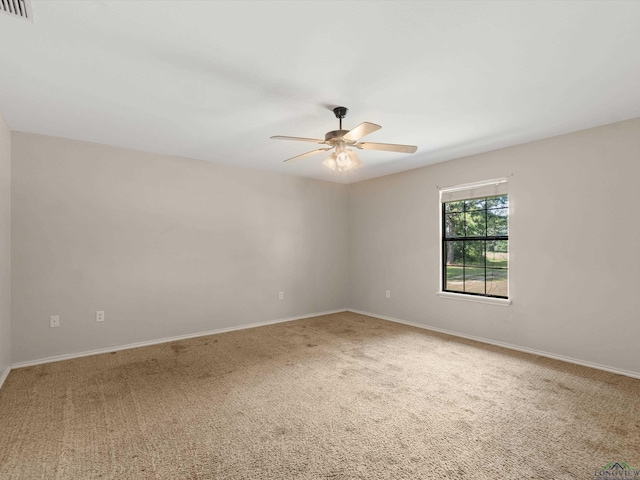 carpeted empty room with ceiling fan