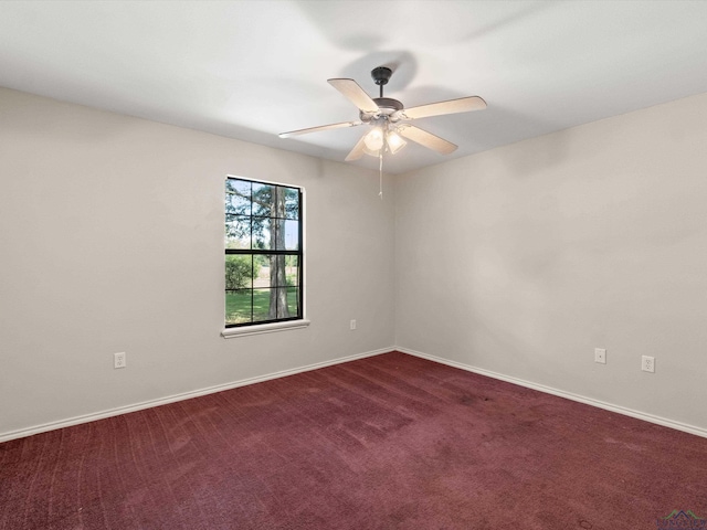 empty room with carpet flooring and ceiling fan