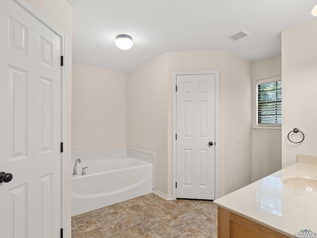 bathroom featuring vanity and a bathtub