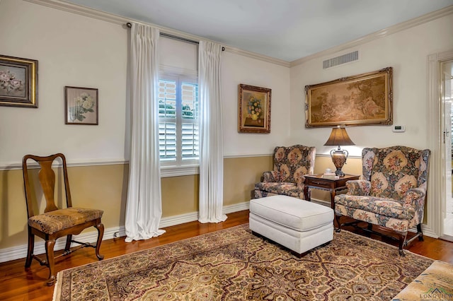 603 E Melton, Longview, TX 75602 - living area featuring wood finished floors, baseboards, and ornamental molding