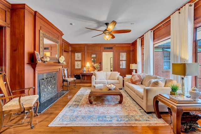 603 E Melton, Longview, TX 75602 - living room with a ceiling fan, a fireplace, and wood finished floors