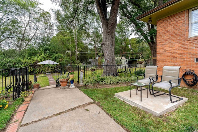 603 E Melton, Longview, TX 75602 - view of yard featuring a patio area and view of scattered trees