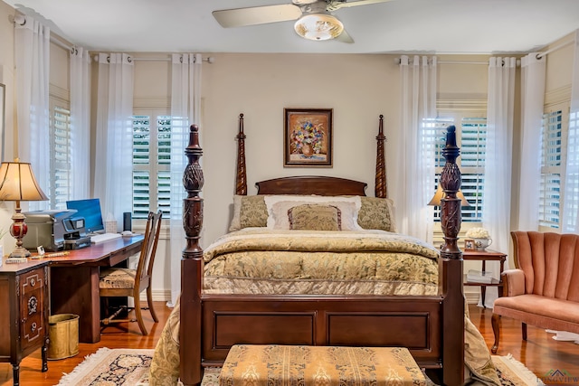 603 E Melton, Longview, TX 75602 - bedroom with wood finished floors, an office area, and a ceiling fan