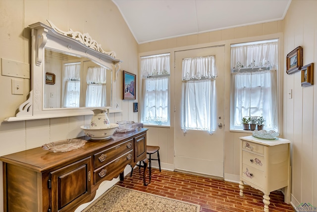 603 E Melton, Longview, TX 75602 - entryway featuring vaulted ceiling, ornamental molding, brick patterned flooring, and plenty of natural light