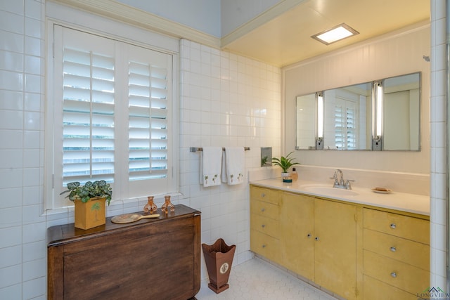 603 E Melton, Longview, TX 75602 - bathroom featuring tile walls, vanity, and tile patterned floors