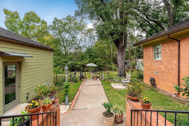 603 E Melton, Longview, TX 75602 - view of yard with a patio and view of scattered trees