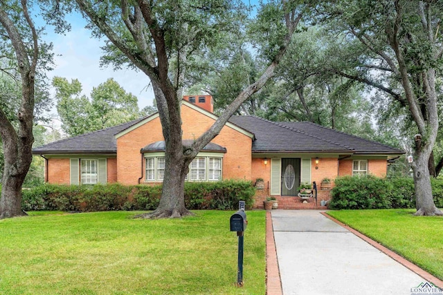 603 E Melton, Longview, TX 75602 - view of front of property featuring brick siding and a front yard