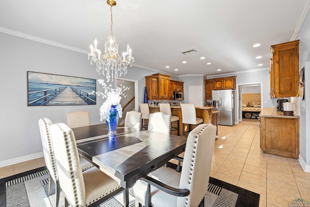 tiled dining area featuring crown molding and a chandelier