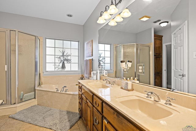 bathroom featuring tile patterned floors, vanity, independent shower and bath, and a notable chandelier