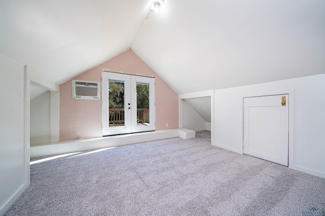 bonus room with carpet, a wall mounted air conditioner, lofted ceiling, and french doors