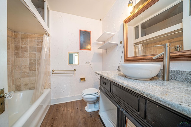 full bathroom with shower / tub combo with curtain, vanity, wood-type flooring, and toilet