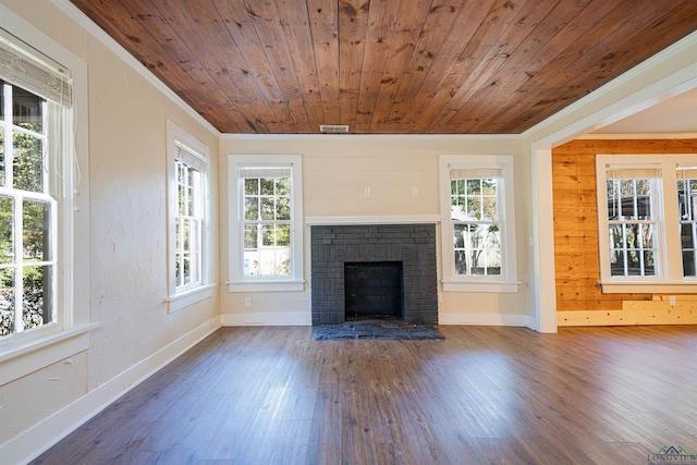 unfurnished living room featuring wooden ceiling, a fireplace, and ornamental molding